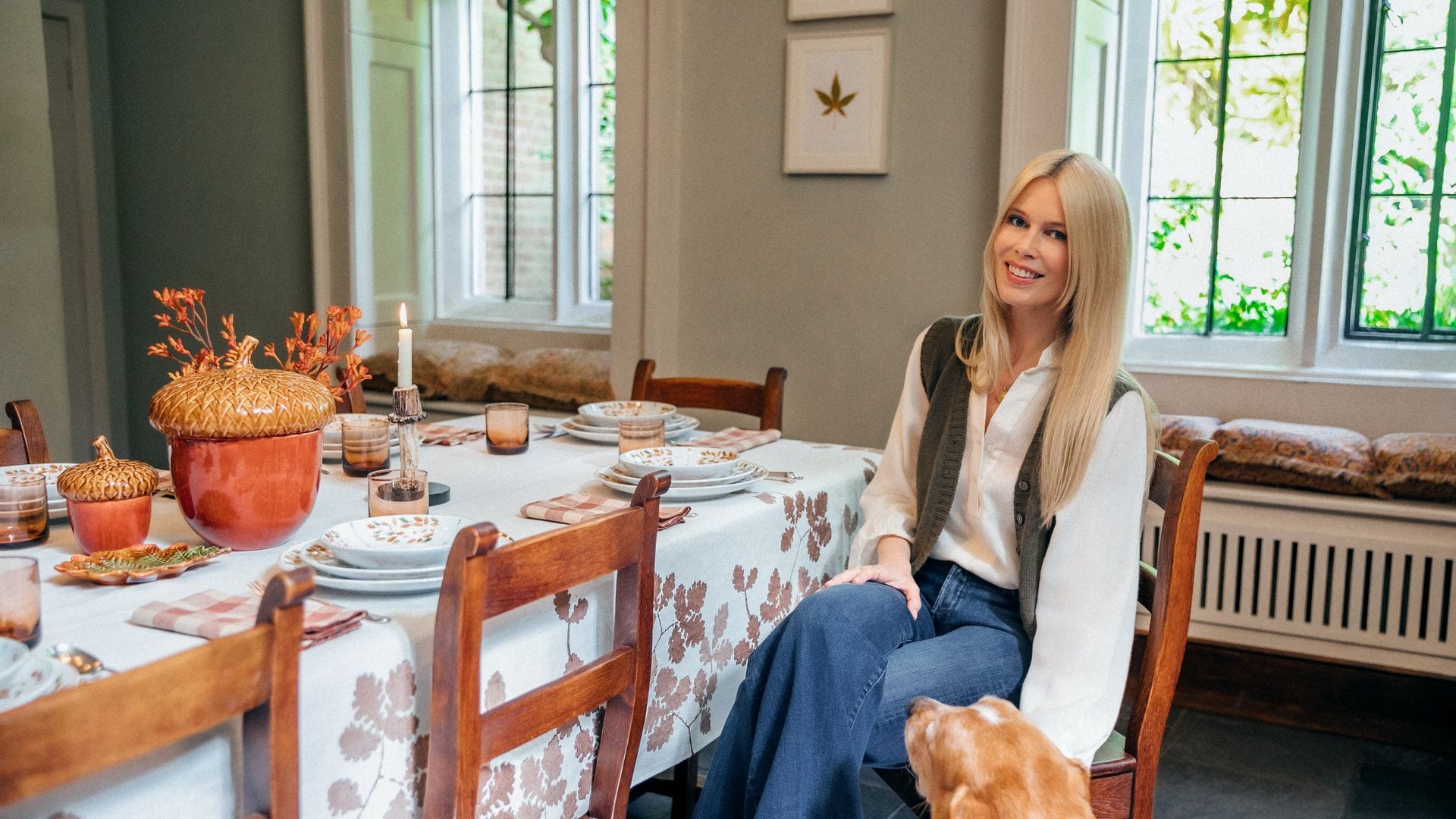 Claudia Schiffer poses at the table decorated with the tableware designed by her