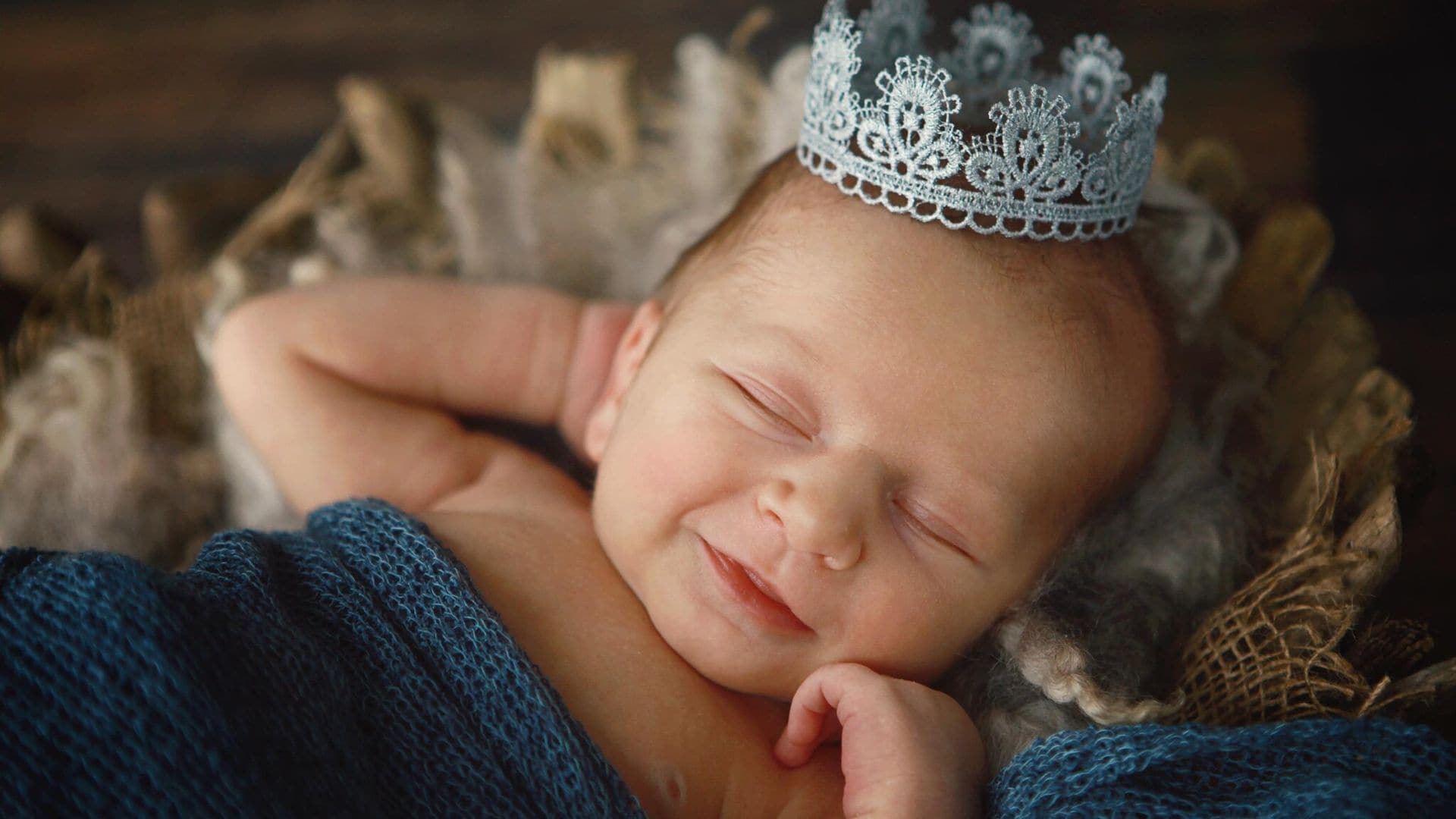 newborn baby boy wearing crown