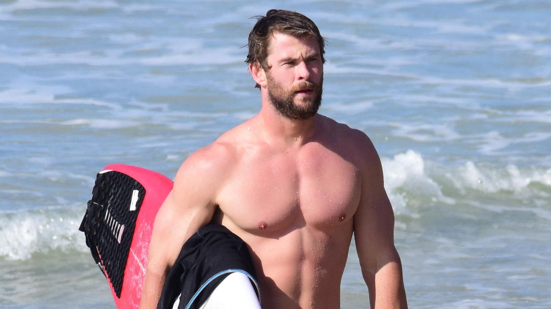 chris hemsworth surfing