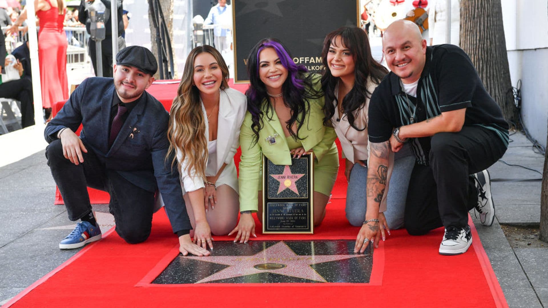 US-Mexican singer songwriter Jenni Rivera's children (L-R) Johnny Lopez, Chiquis Rivera, Jacqie Rivera, Jenicka Lopez and Michael Rivera pose on the star of their late mother during her posthumous Walk of Fame ceremony in front of Capitol Records in Hollywood, California, June 27, 2024. (Photo by VALERIE MACON / AFP) (Photo by VALERIE MACON/AFP via Getty Images)