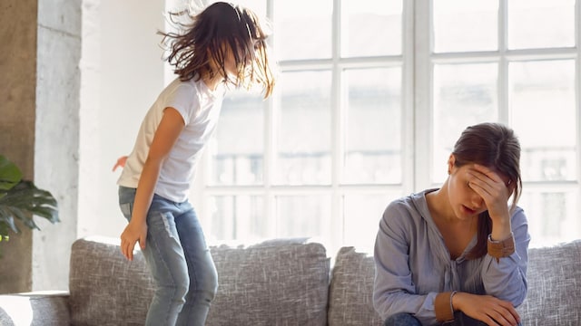 upset mother having problem with noisy naughty daughter