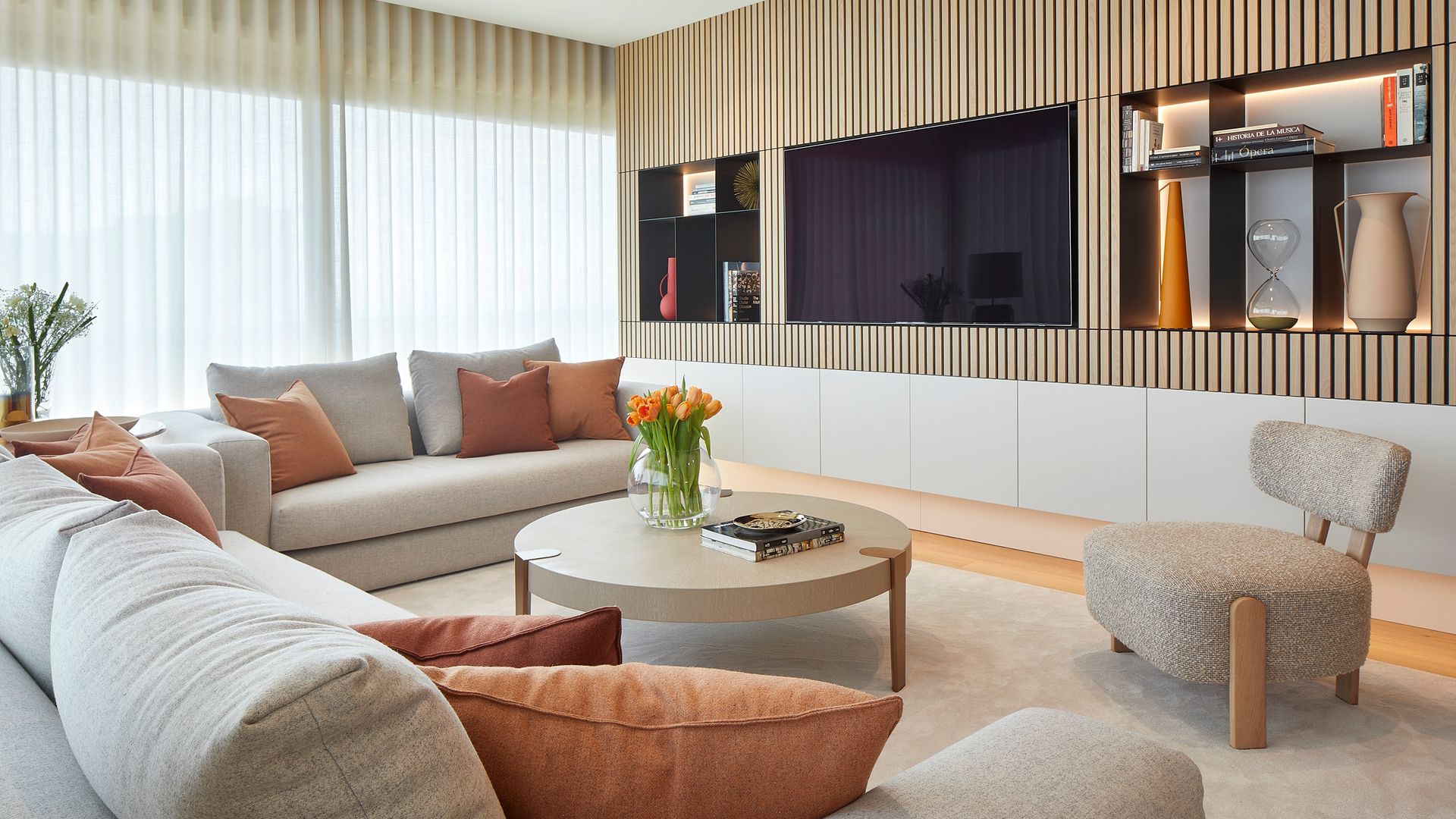 Living room with custom furniture to integrate the television