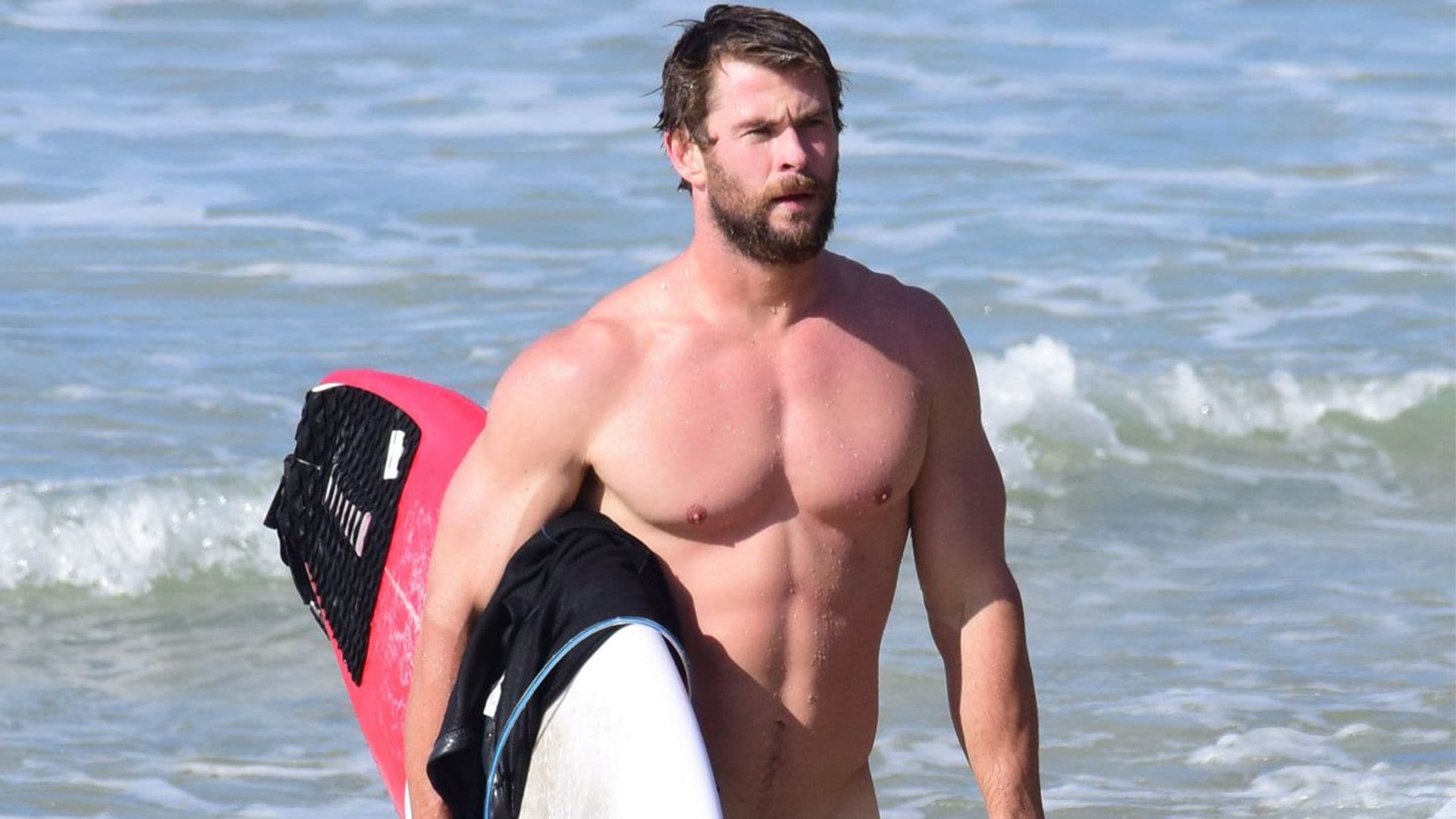 chris hemsworth surfing