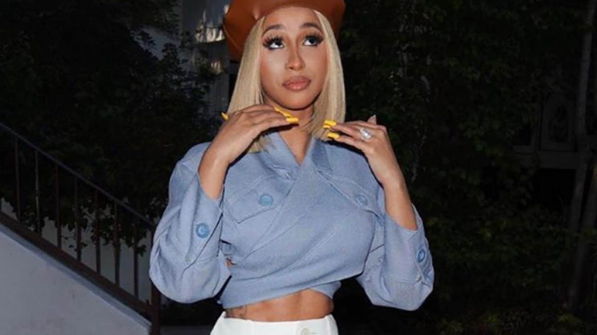 Cardi B shows off incredible toned abs as she raps in crop top