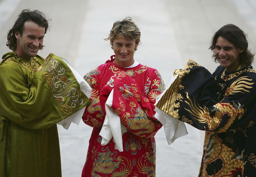 BEIJING - SEPTEMBER 13:  Spanish tennis players Carlos Moya (L), Juan Carlos Ferrero (C) and Rafael Nadal wear replicas of the robes once worn by China's emperors as they pose during a photo opportunity at the Imperial Ancestral Temple on September 13, 2005  in Beijing, China. The three are in Beijing to compete in the China Open tennis tournament, which started Saturday.  (Photo by Cancan Chu/Getty Images)