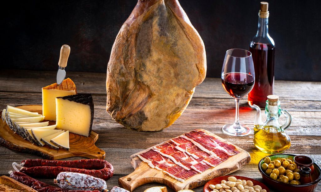 iberian ham leg hanged cheese and wine