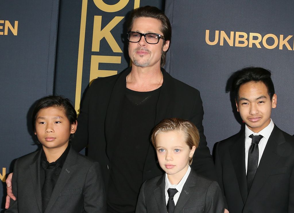 Brad Pitt con sus hijos. 2014