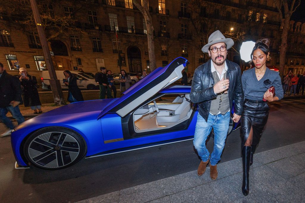 Zoe Saldana and her husband Marco Perego arrive with the Electric Car Jaguar Type 00 concept to the hotel The Peninsula Paris, within the framework of the Paris Fashion Week (PFW).