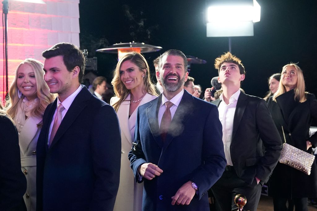 (L-R) Tiffany Trump, her husband Michael Boulos, Bettina Anderson and Donald Trump Jr. walk inside after watching fireworks at Trump National Golf Club Washington DC in Sterling, Virginia, on January 18, 2025. (Photo by Alex Brandon / POOL / AFP) (Photo by ALEX BRANDON/POOL/AFP via Getty Images)