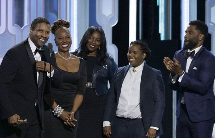 Denzel Washington con su mujer y sus hijos