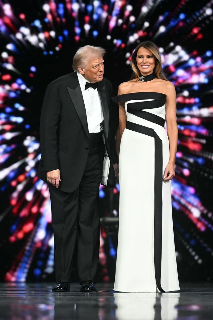 US President Donald Trump (L) and First Lady Melania Trump arrive for the Liberty inaugural ball in Washington, DC, on January 20, 2025. (Photo by Jim WATSON / AFP) (Photo by JIM WATSON/AFP via Getty Images)