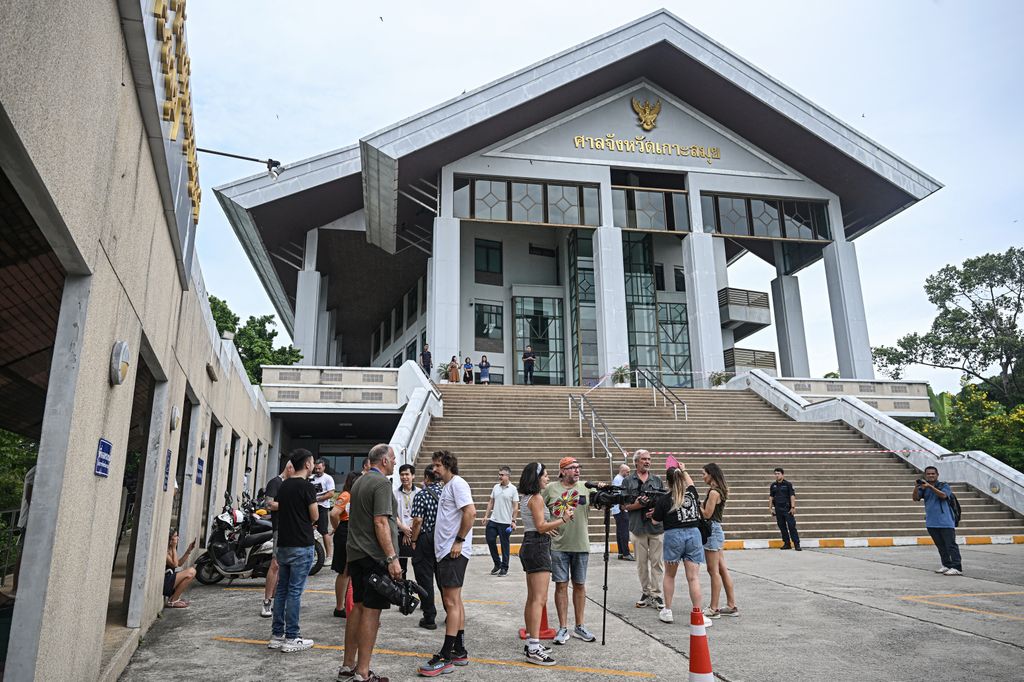 Members of the media stand outside court on the ruling day for the trial of Daniel Sancho Bronchalo, who is accused of killing Colombian plastic surgeon Edwin Arrieta Arteaga on the island of Koh Pha Ngan in August 2023, at the Koh Samui Provincial Court on August 29, 2024. (Photo by Lillian SUWANRUMPHA / AFP) (Photo by LILLIAN SUWANRUMPHA/AFP via Getty Images)