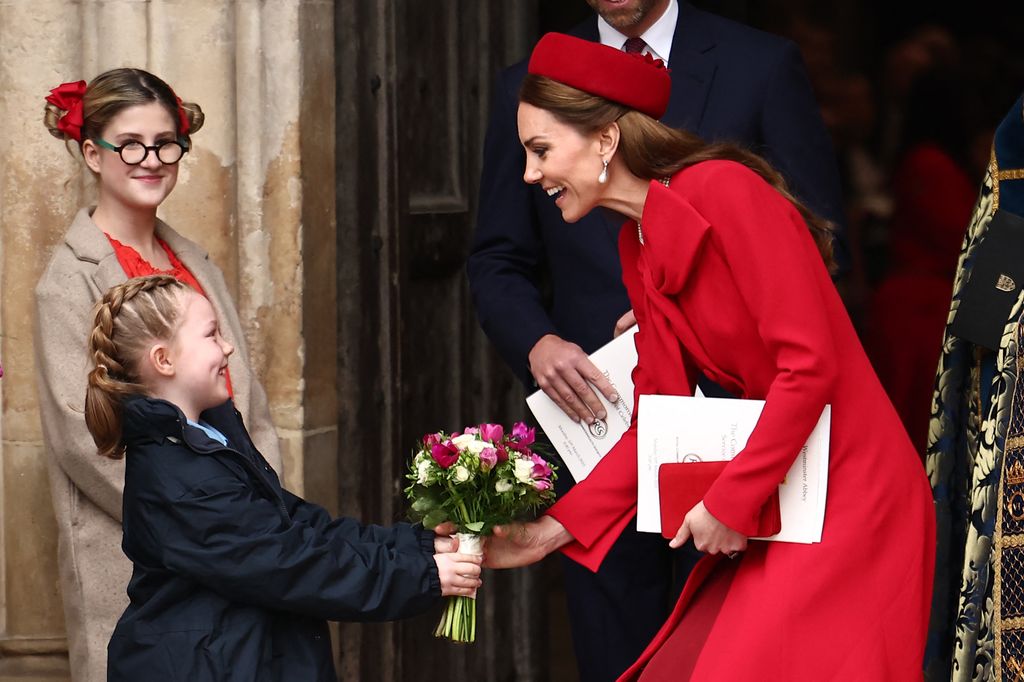         Britain's Catherine, Princess of Wales receives a posy of flowers as she leaves the annual Commonwealth Day service ceremony at Westminster Abbey in London, on March 10, 2025 . (Photo by HENRY NICHOLLS / AFP) (Photo by HENRY NICHOLLS/AFP via Getty Images)          