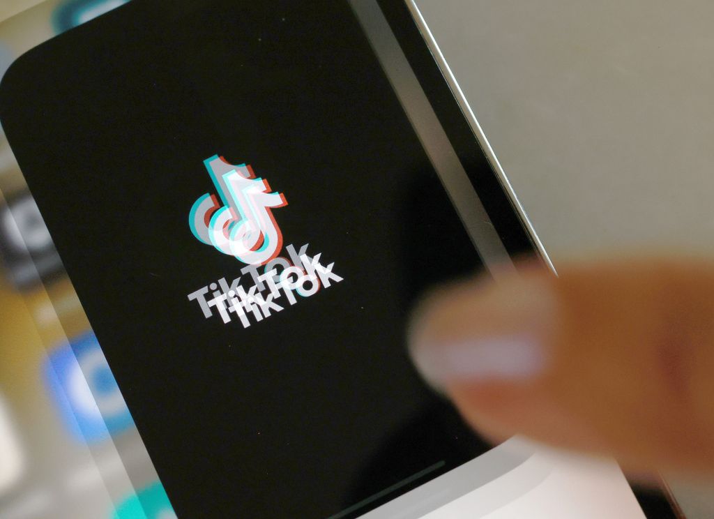 MIAMI, FLORIDA - APRIL 24: In this photo illustration, the TikTok app is displayed on an iPhone screen on April 24, 2024 in Miami, Florida. President Joe Biden signed a foreign aid package that includes a bill that would ban TikTok if China-based parent company ByteDance fails to sell the app to an American company within a year. (Photo illustration by Joe Raedle/Getty Images)