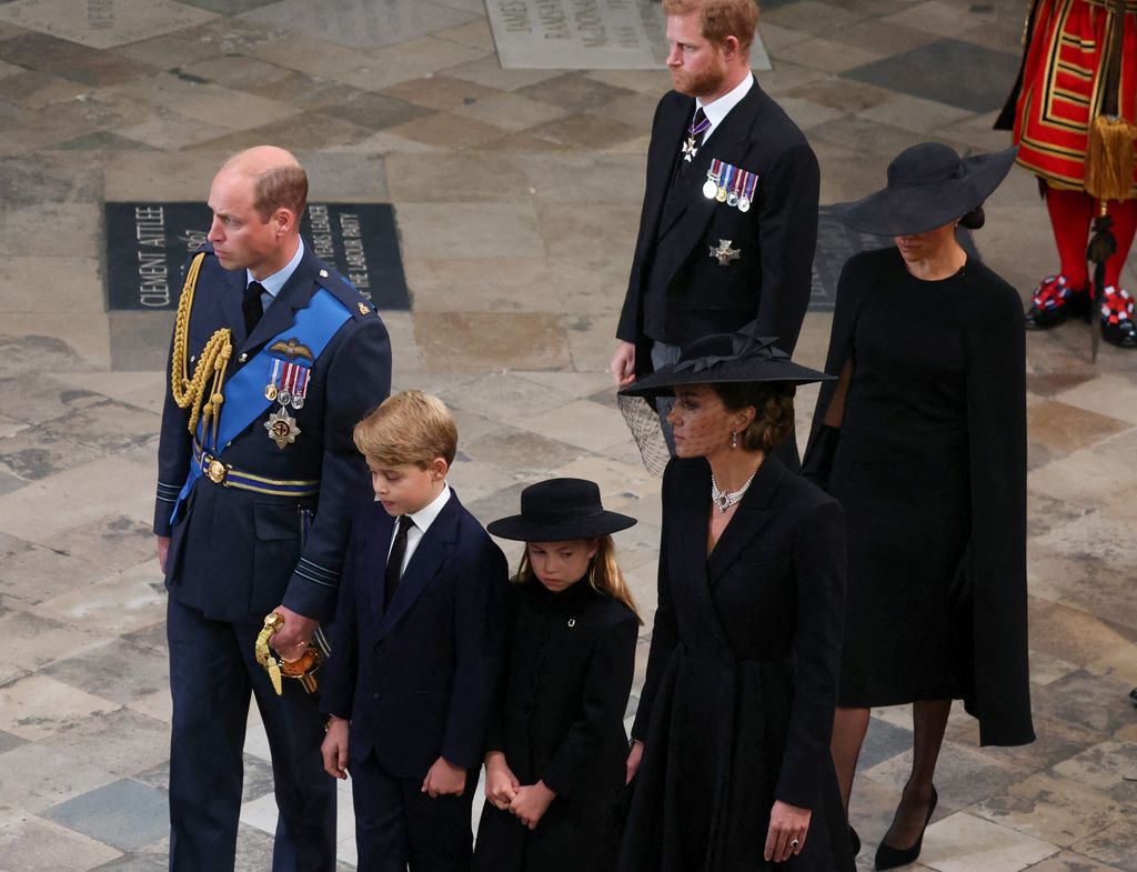 Britain's William, Prince of Wales, Britain's Prince George of Wales, Britain's Princess Charlotte of Wales, Catherine, Princess of Wales, Britain's Prince Harry, Duke of Sussex and Meghan, Duchess of Sussex attend the state funeral and burial of Britain's Queen Elizabeth, at Westminster Abbey in London, Britain, on September 19, 2022. 