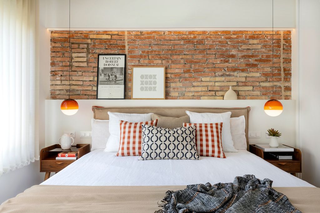 Modern bedroom with brick walls.