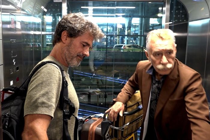 Rodolfo Sancho con su abogado a su llegada a Madrid