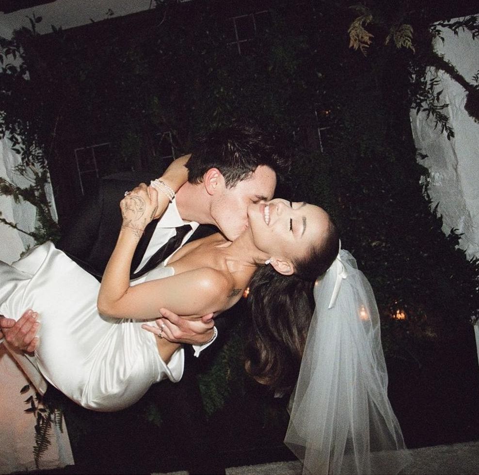 Ariana Grande and Dalton Gomez kiss at their wedding