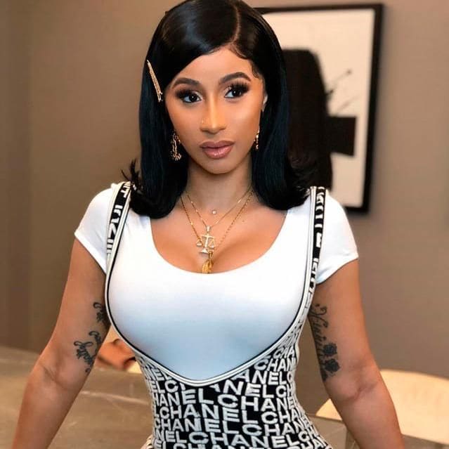 cardi b con flip hairstyle