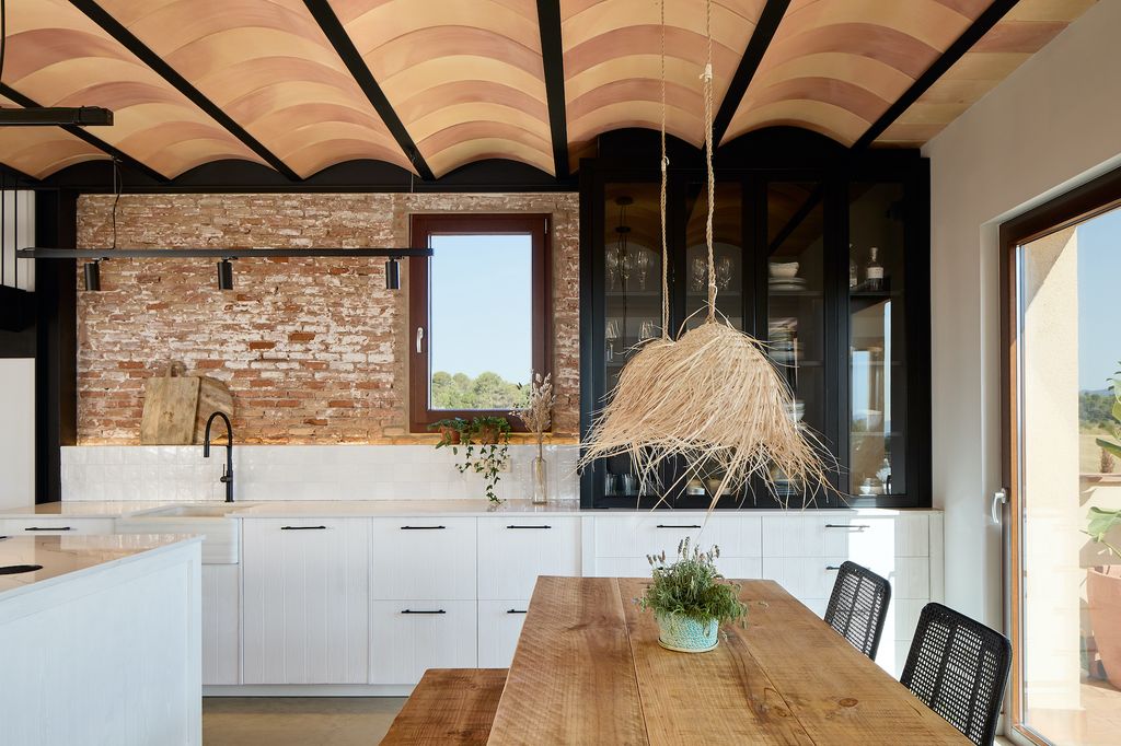 Modern kitchen with brick walls.