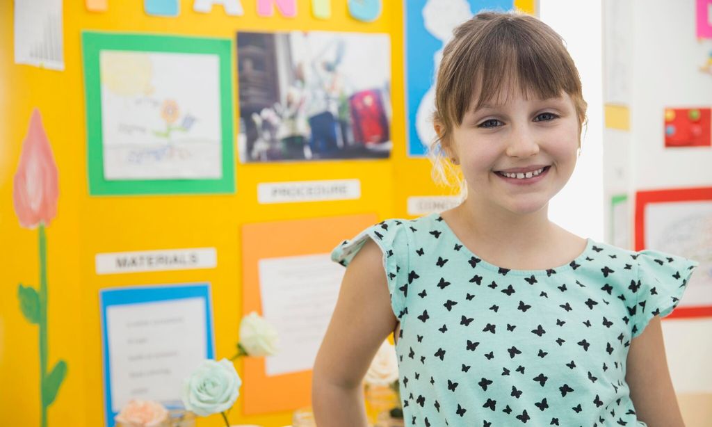 portrait of confident school girl at science fair