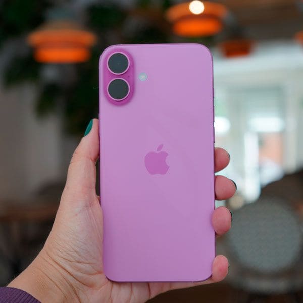 An iPhone 16 from behind held in one hand