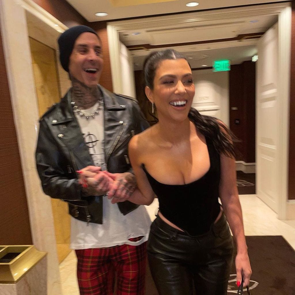 travis barker and kourtney kardashian run through a hotel in las vegas