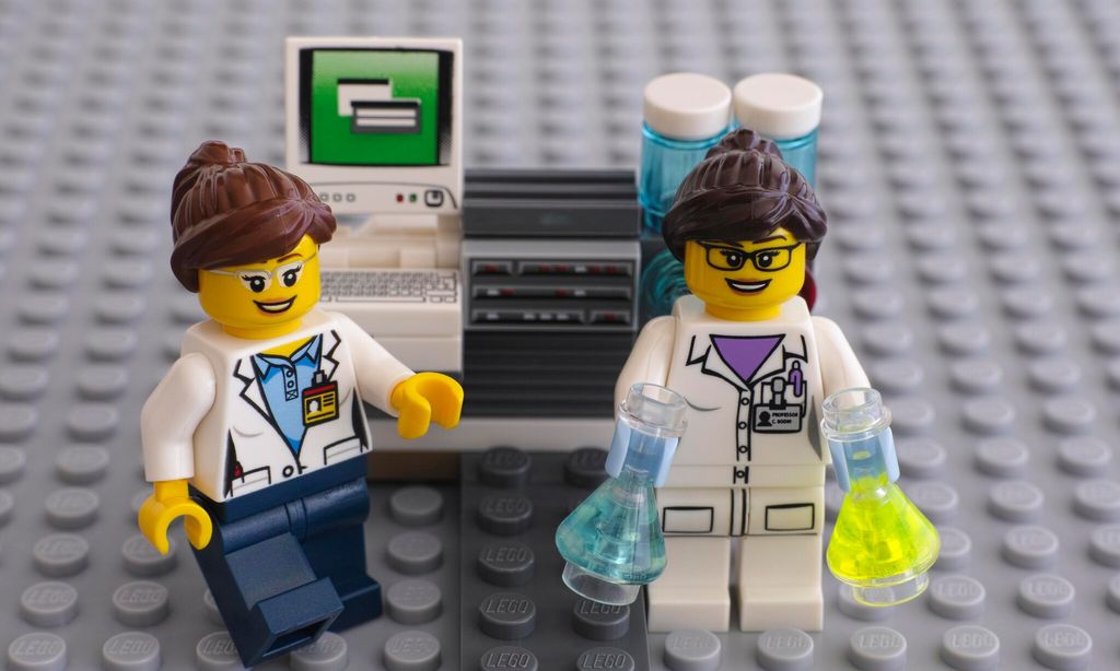 two lego scientists near laboratory computer