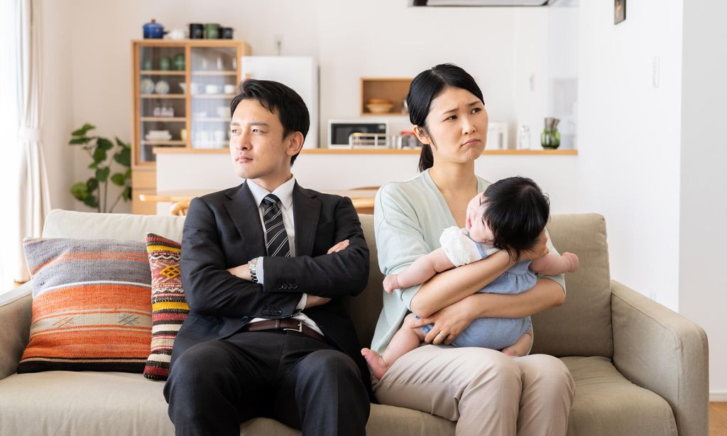 young asian family in living room