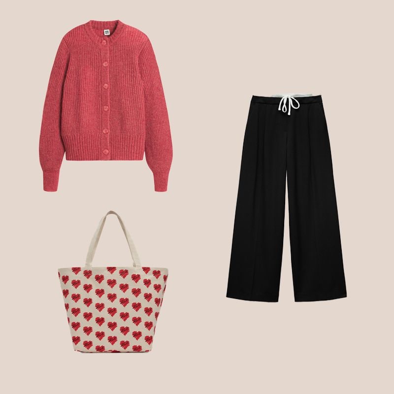 pantalones negros con cardigan  de punto rosa y bolso de corazones shopper