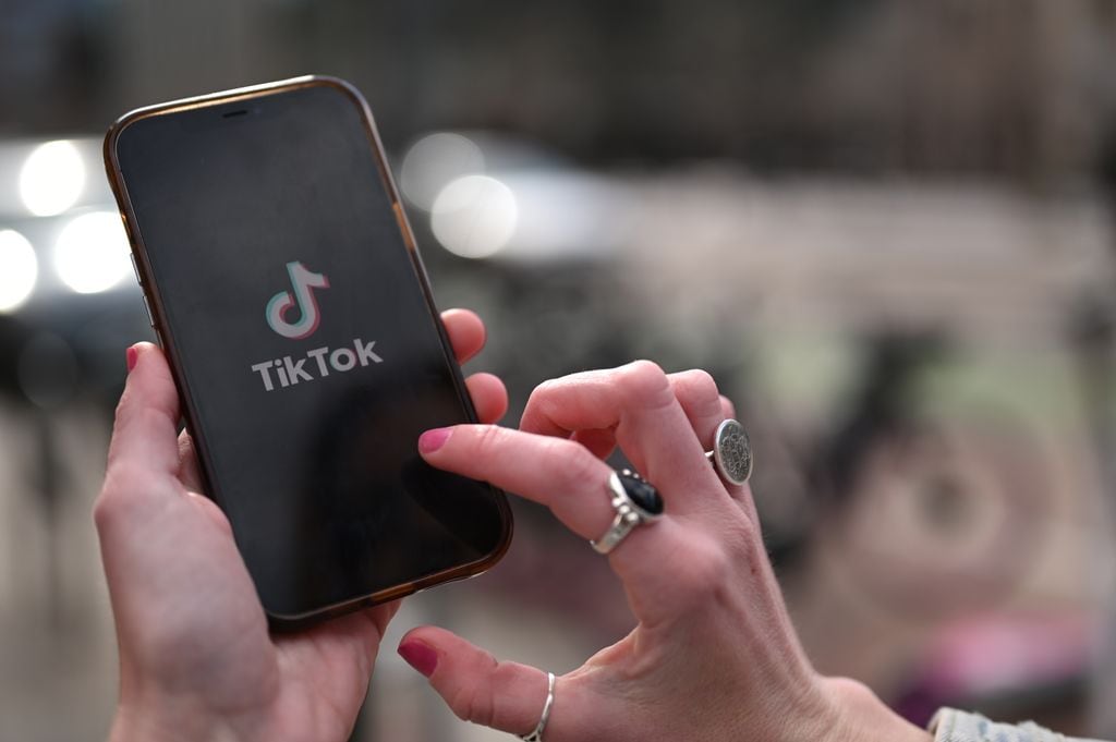 DENVER, CO - MARCH 28 : Amanda Bittner displays TikTok logo on her cellphone in front of Union Station in Denver, Colorado on Tuesday, March 28, 2023. (Photo by Hyoung Chang/The Denver Post)