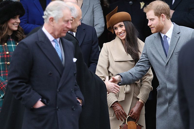 Príncipe Carlos, Meghan Markle y el príncipe Harry