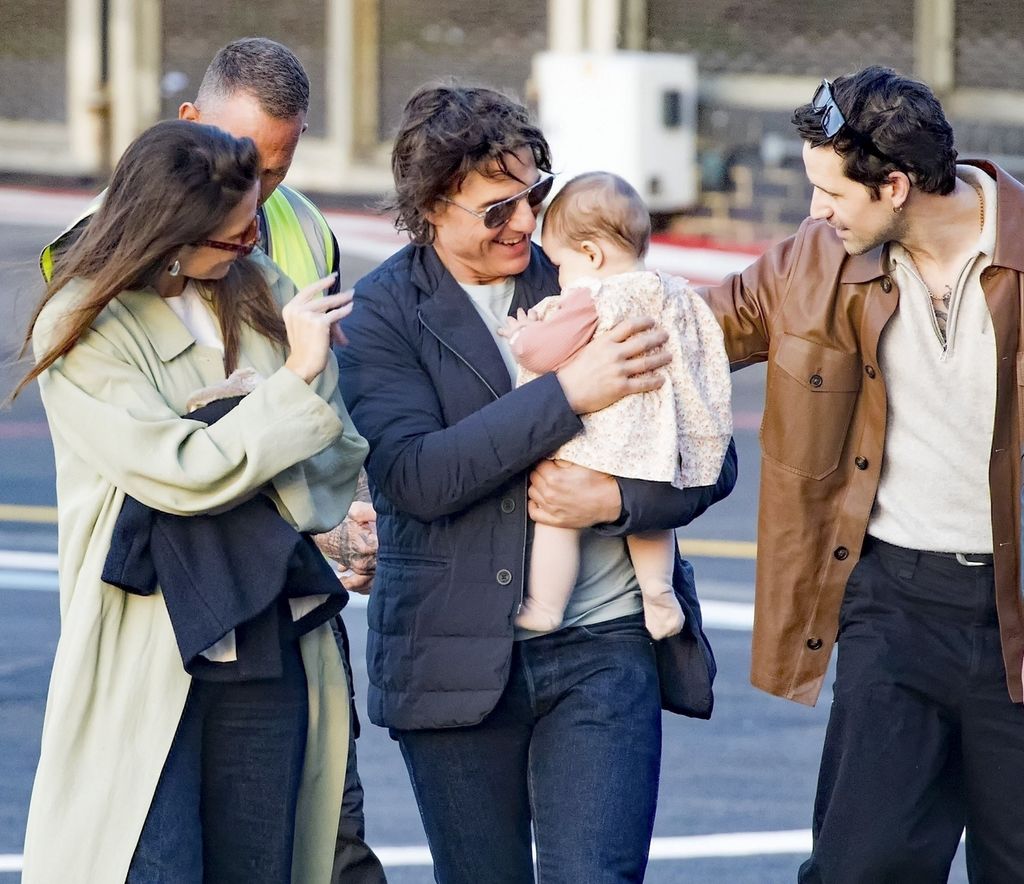   Tom Cruise is captured by loading a baby tenderly