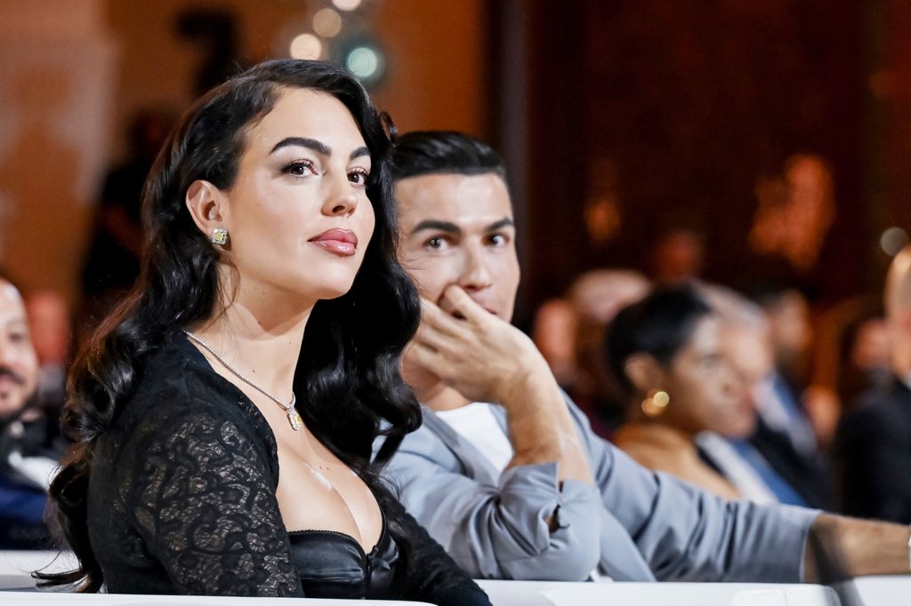 Cristiano Ronaldo (2nd L) and Georgina Rodriguez (L) attend the Globe Soccer Dubai Awards 2024 as part of the Dubai International Sports Conference 2024 in Dubai, United Arab Emirates (UAE) on December 27, 2024. (Photo by Waleed Zein/Anadolu via Getty Images)