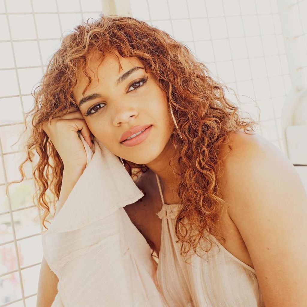 leslie grace curly texture bangs