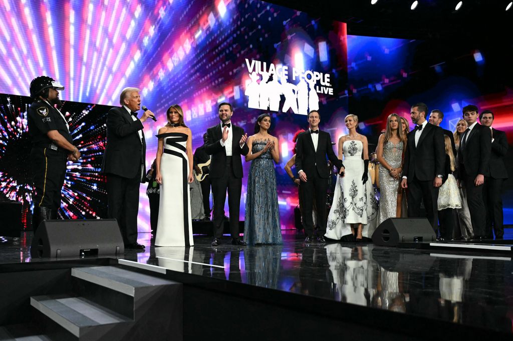 US President Donald Trump (2nd L) stands with First Lady Melania Trump, US Vice President J.D. Vance, Second Lady Usha Vance, Jared Kushner, daughter Ivanka Trump, granddaughter Kai Madison Trump, sons Donald Trump Jr. and Eric Trump, and daughter Tiffany during the Liberty inaugural ball in Washington, DC, on January 20, 2025. (Photo by Jim WATSON / AFP) (Photo by JIM WATSON/AFP via Getty Images)