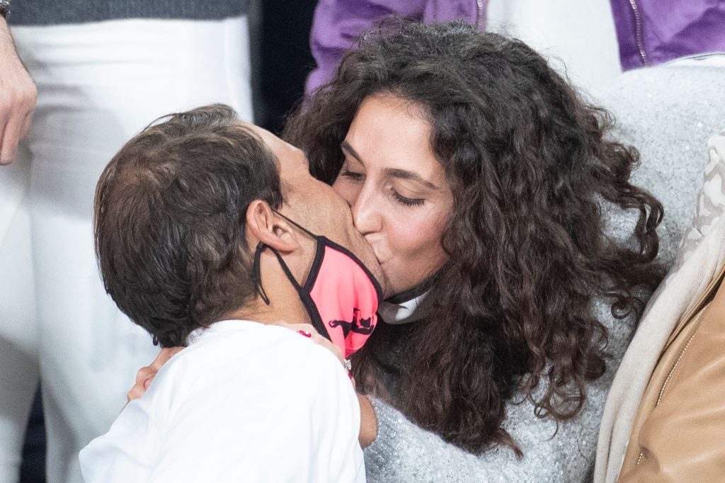 PARIS, FRANCE October 11.  Rafael Nadal of Spain receives a congratulatory kiss from his wife Xisca Perello after his victory against Novak Djokovic of Serbia in the Men's Singles Final on Court Philippe-Chatrier during the French Open Tennis Tournament at Roland Garros on October 11th 2020 in Paris, France. (Photo by Tim Clayton/Corbis via Getty Images)