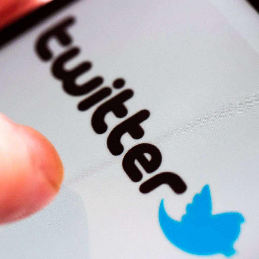 in this photo illustration a twitter logo seen displayed on