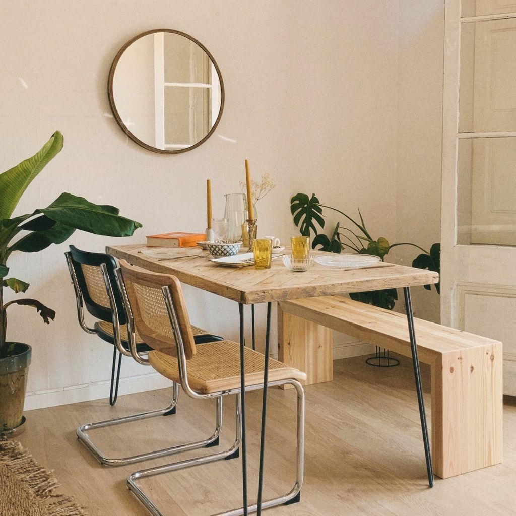 Dining room wall with round mirror