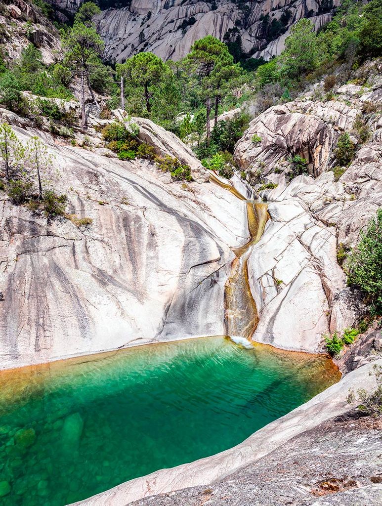 waterfall and natural pool in purcaraccia canyon in bavella 2a13n97