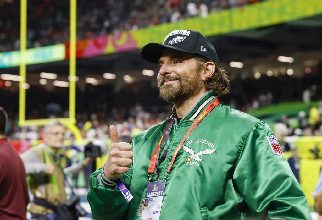 Bradley Cooper wears a Philadelphia Eagles jacket on the sideline before the team faces the Kansas City Chiefs during Super Bowl LIX at Caesars Superdome in New Orleans on Sunday, February 9, 2025