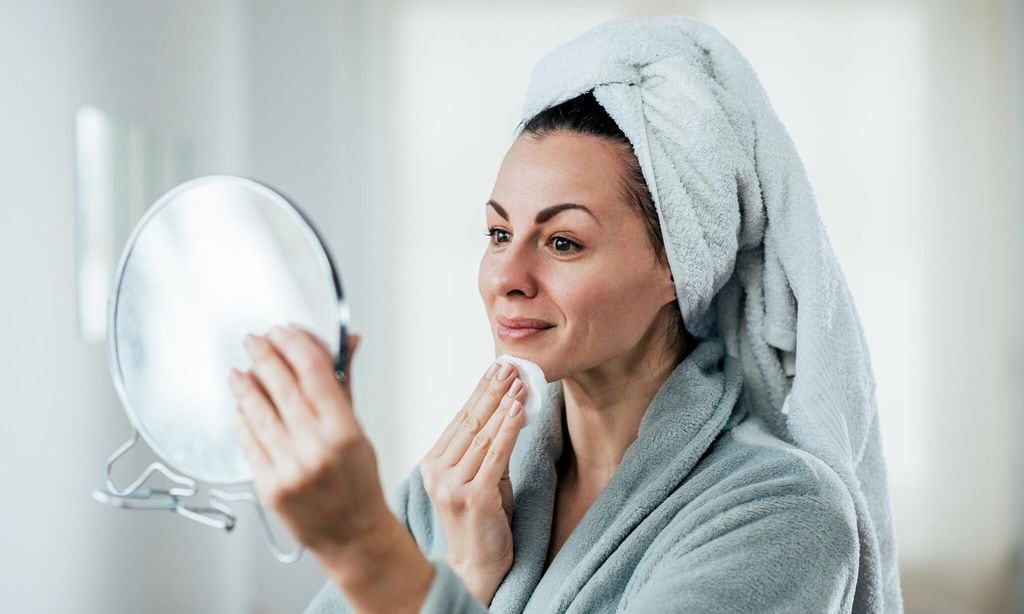 beauty hygiene and people concept a picture of a woman cleaning her face 