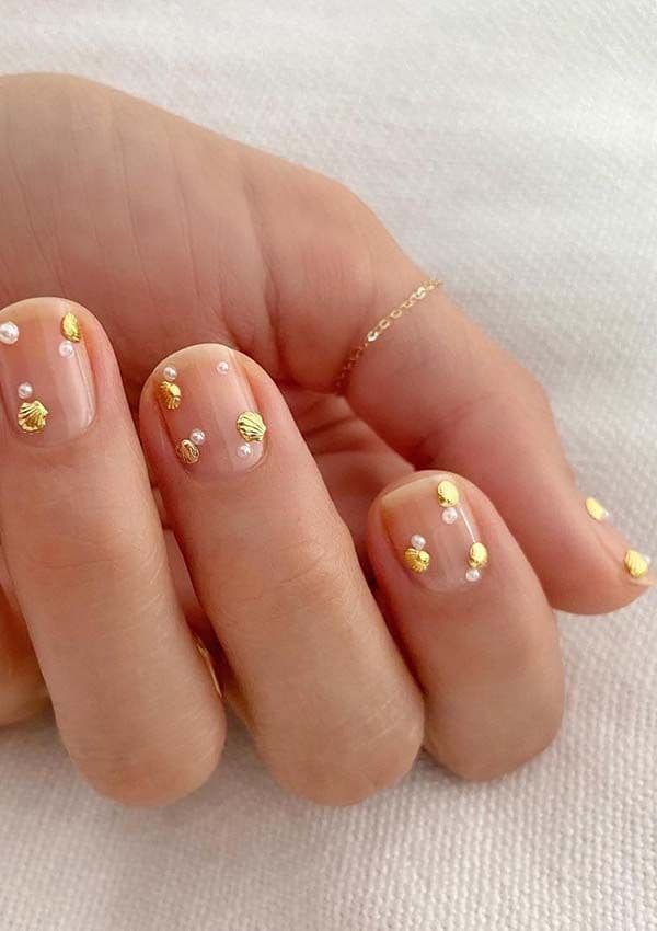 manicura perlas conchas