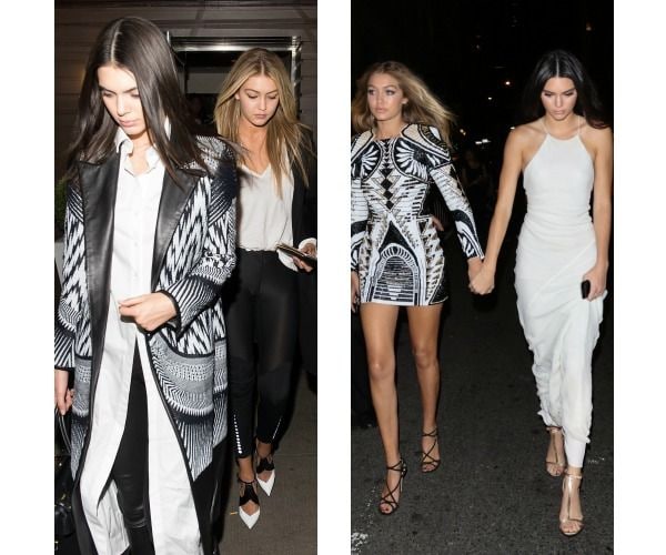 Iguales pero diferentes: en Nueva York el pasado mes de septiembre, Gigi con uno de los diseños de Balmain para H&M con geometrías en blanco y negro, y Kendall con un vestido halter liso en all white.
