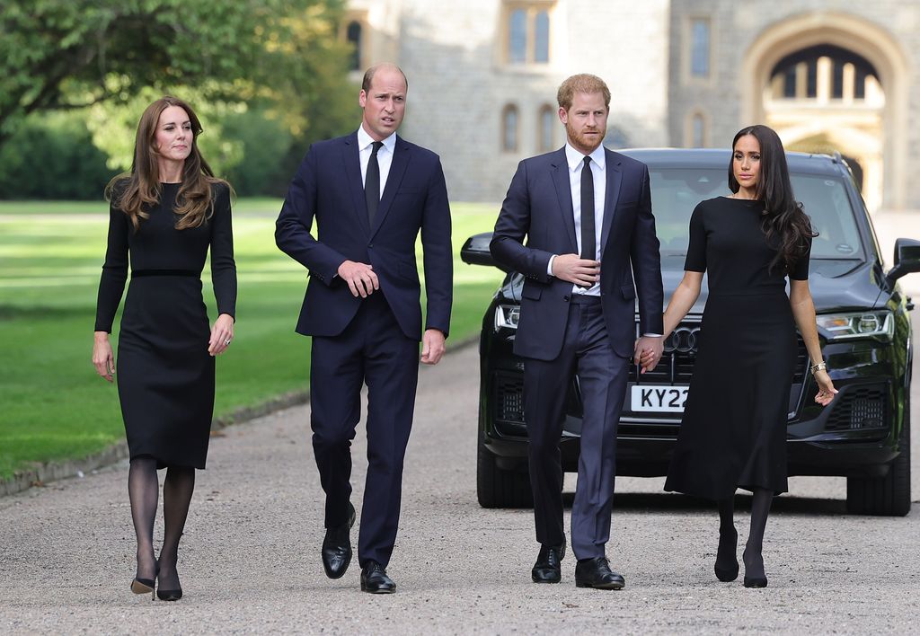 Catherine, Princess of Wales, Prince William, Prince of Wales, Prince Harry, Duke of Sussex, and Meghan, Duchess of Sussex on the long Walk at Windsor Castle arrive to view flowers and tributes to HM Queen Elizabeth on September 10, 2022 in Windsor, England. Crowds have gathered and tributes left at the gates of Windsor Castle to Queen Elizabeth II, who died at Balmoral Castle on 8 September, 2022. 