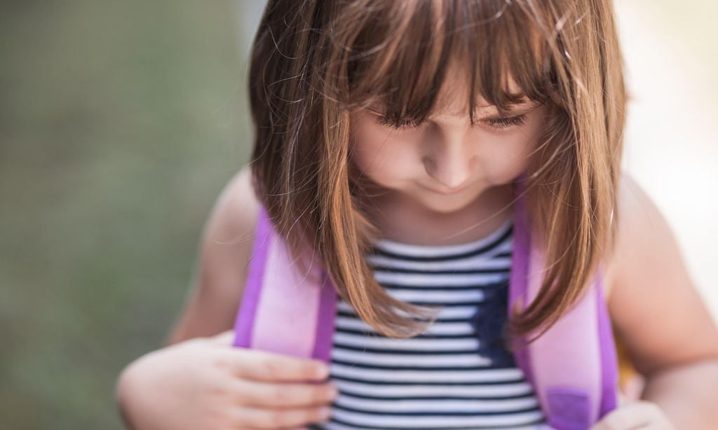 Young girl having her first school bag