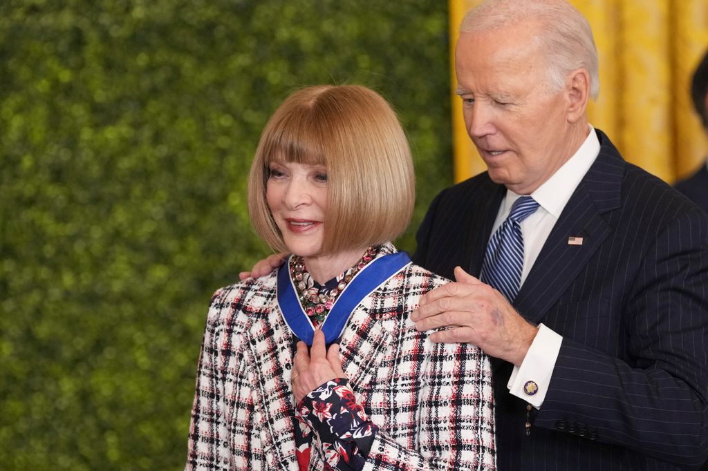 Fashion icon Anna Wintour receives the Medal of Freedom from United States President Joe Biden during a ceremony at the White House in Washington, DC, January 4, 2025. (Photo by Chris Kleponis / AFP) (Photo by CHRIS KLEPONIS/AFP via Getty Images)