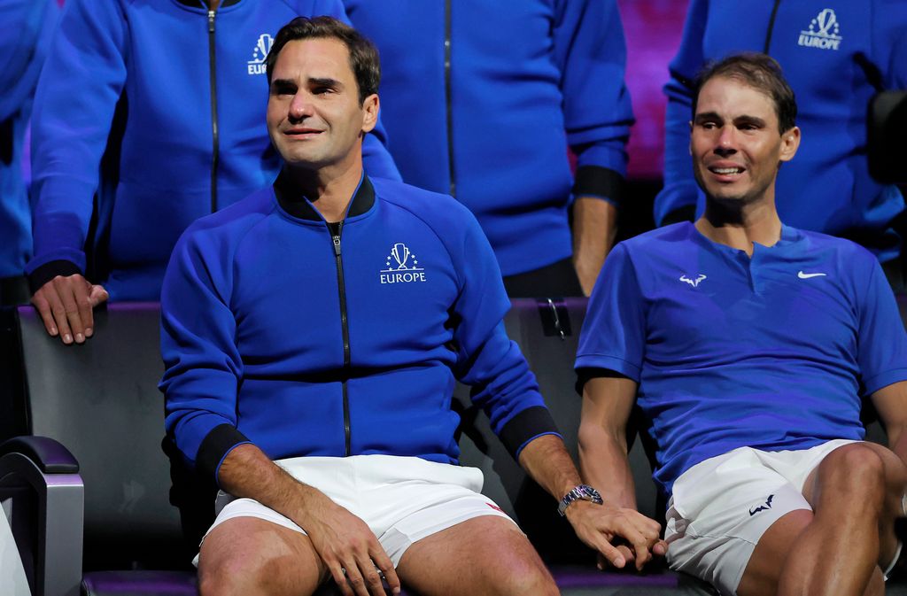 Roger Federer and Rafael Nadal in tears and holding hands after their doubles game against Frances Tiafoe and Jack Sock, the final match before Federer's retirement, during day one the Laver Cup tennis tournament at the O2 Arena on September 23rd 2022 in Greenwich, London (Photo by Tom Jenkins/Getty Images)