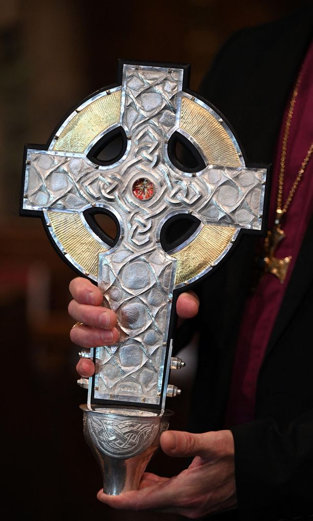 The processional cross contains a relic of the True Cross