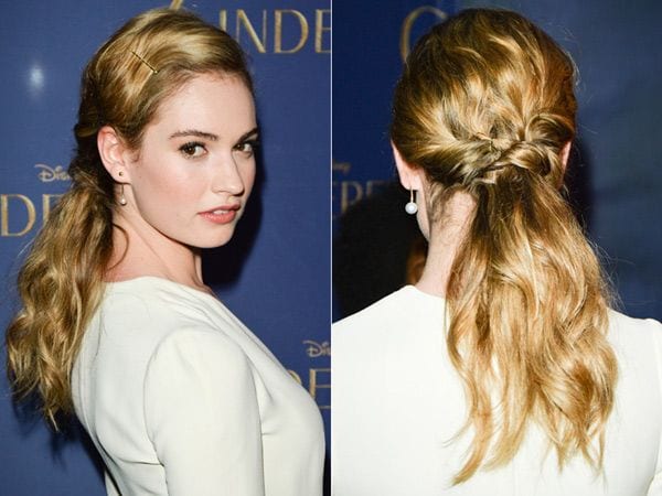 Lily James, la nueva Cenicienta, con un original semirrecogido trenzado, ondulado de medios a puntas, en el que el mechón del flequillo se sujeta con una horquilla.
